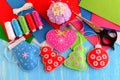 Christmas tree decorations crafts. Felt pink heart, red and green Christmas tree, blue mitten, red ball on wooden background Royalty Free Stock Photo