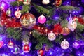 Christmas tree with decorations, fairy lights surrounded by many beautiful handmade painted colored balls for Christmas. Royalty Free Stock Photo