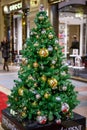 Christmas tree with decorations in GUM department store shopping mall. Walking people on background. New Year, winter holidays, Royalty Free Stock Photo