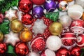 Christmas tree decorations laid out on a flat horizontal surface. Christmas balls and stars
