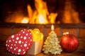 Christmas tree decorations near fireplace Royalty Free Stock Photo