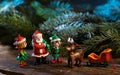 Christmas tree decorations. Santa Claus with elves and reindeer