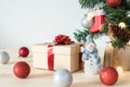 Christmas tree decorations on table. New Year concept. Christmas tree, toy snowman, gift box and balls Royalty Free Stock Photo