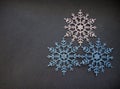 Christmas tree decorations three snowflakes on grey background winter holiday