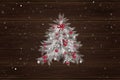 Christmas tree with decorations on the wood background Royalty Free Stock Photo