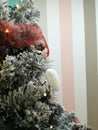 Christmas tree decotared with white sparkling heart and lights. Royalty Free Stock Photo