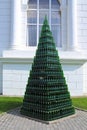 Christmas tree from empty bottles of sparkling wine on the background of the window of the winery Abrau-Durso in the vicinity of Royalty Free Stock Photo