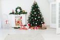 Christmas tree fireplace with gifts decor garland interior new year Royalty Free Stock Photo