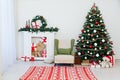 Christmas tree fireplace with gifts decor garland interior new year Royalty Free Stock Photo