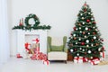 Christmas tree fireplace with gifts decor garland interior new year Royalty Free Stock Photo