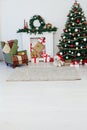 Christmas tree with fireplace interior of white room new year decoration garland gifts Royalty Free Stock Photo