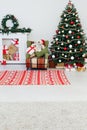 Christmas tree with fireplace interior of white room new year decoration garland gifts Royalty Free Stock Photo