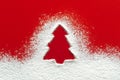 Christmas tree floury snow shape, red paper background Royalty Free Stock Photo
