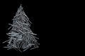 christmas tree folded of construction nails isolated on black background Royalty Free Stock Photo