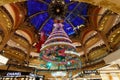 Christmas tree in Galeries Lafayette in Paris on Boulevard Haussmann. Galeries Lafayette is one of most popular, chic Royalty Free Stock Photo