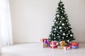 Christmas tree Garland lights new year holiday gifts white home decor Royalty Free Stock Photo