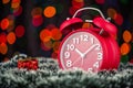 Christmas tree, gifts, lights and alarm clock on abstract background. Royalty Free Stock Photo