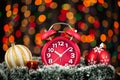 Christmas tree, gifts, lights and alarm clock on abstract background. Royalty Free Stock Photo