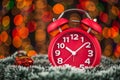 Christmas tree, gifts, lights and alarm clock on abstract background. Royalty Free Stock Photo