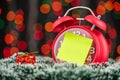 Christmas tree, gifts, lights and alarm clock on abstract background Royalty Free Stock Photo