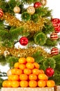 Christmas tree with gifts and presents and mandarines Royalty Free Stock Photo