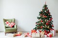 Christmas tree with gifts of red white interior decor for the new year Royalty Free Stock Photo