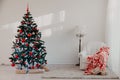 Christmas tree with Christmas gifts in White Hall on Christmas Royalty Free Stock Photo