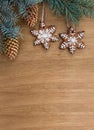 Christmas tree with christmas gingerbread and cones spruce on a wooden background with space for text. Top view, flat lay Royalty Free Stock Photo