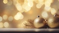 Christmas Tree With gold Baubles close-up against backdrop of golden sparkling Christmas lights. Wide format banner. Royalty Free Stock Photo