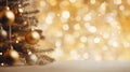 Christmas Tree With gold Baubles close-up against backdrop of golden sparkling Christmas lights. Wide format banner. Royalty Free Stock Photo