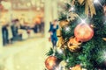 Christmas tree with gold decoration in shopping mall.