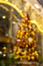 christmas tree in shopping mall out of focus, xmas bokeh lights Royalty Free Stock Photo