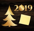 Christmas tree of gold with figures 2019 of paper. New Year, Christmas, winter theme. Yellow sheet of paper for notes. Sticker. V