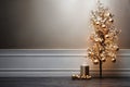 Christmas tree with golden decoration and gifts on a floor near a white wall, empty background, copy space, New Year Royalty Free Stock Photo