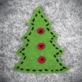 Christmas tree on gray felt Royalty Free Stock Photo