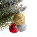 Christmas tree. Green pine branches decorated with a golden ball. Out of focus red and silver balls in the background. Close up Royalty Free Stock Photo