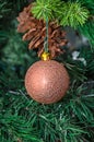 Christmas tree hanging ornament, bronze globe, close up