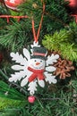 Christmas tree hanging ornament, snowflake and snowman, close up Royalty Free Stock Photo