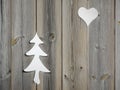 Christmas tree and heart motifs in wooden shutter boards Royalty Free Stock Photo