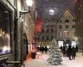 Christmas Night  moon on sky In Tallinn Old Town  tree illuminated on evening winter in medieval city street ,lantern light blurre Royalty Free Stock Photo