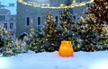 Christmas tree  illumination yellow candle in cup  old town street town hall square  medieval house wall  holiday in Estonia winte Royalty Free Stock Photo