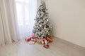 Christmas tree in the Interior of the white room gifts new year holiday Royalty Free Stock Photo