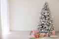 Christmas tree in the Interior of the white room gifts new year holiday Royalty Free Stock Photo