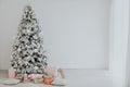 Christmas tree in the Interior of the white room gifts new year holiday Royalty Free Stock Photo