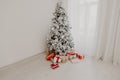 Christmas tree in the Interior of the white room gifts new year holiday Royalty Free Stock Photo