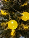 Christmas tree with large yellow balls fragment