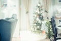 Christmas tree with light string and ball decoration with abstract blur living room bokeh light background at home,Backdrop for w Royalty Free Stock Photo