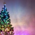 Christmas tree light up with colorful christmas lights on beautiful enchance background with copy space Royalty Free Stock Photo