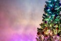 Christmas tree light up with colorful christmas lights on beautiful enchance background with copy space Royalty Free Stock Photo