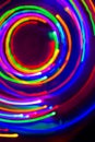 Christmas tree lights spun around to achieve a spiral glowing effect; abstract circular color trails
